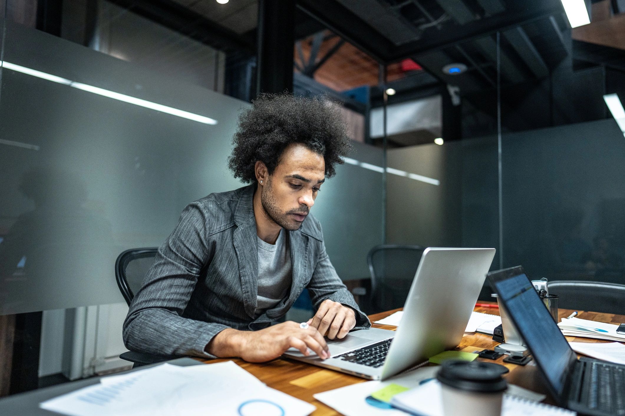 Developer working on a laptop in a modern workspace